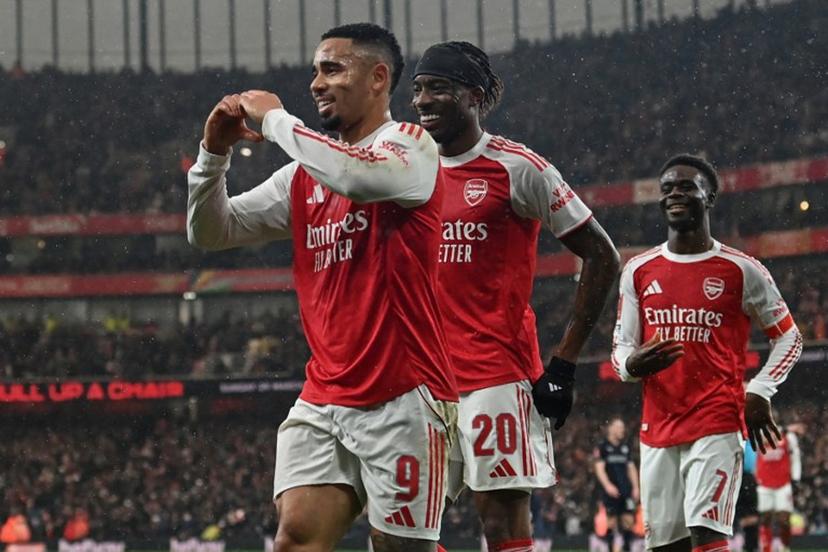 Arsenal's Brazilian striker #09 Gabriel Jesus (L) celebrates after scoring the team's fourth goal during the English FA Cup fourth round football match between Arsenal and Wigan Athletic at the Emirates Stadium in London on February 15, 2026.   Glyn KIRK / AFP