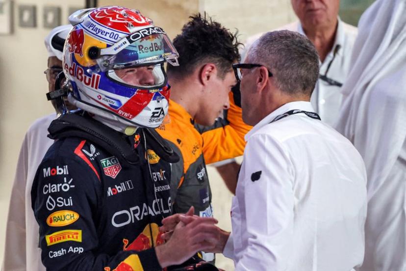 Red Bull Racing's Dutch driver Max Verstappen (L) is congratulated by Formula One CEO Stefano Domenicali (R) after the sprint race ahead of the Qatari Formula One Grand Prix at the Lusail International Circuit on October 7, 2023. Giuseppe CACACE / AFP