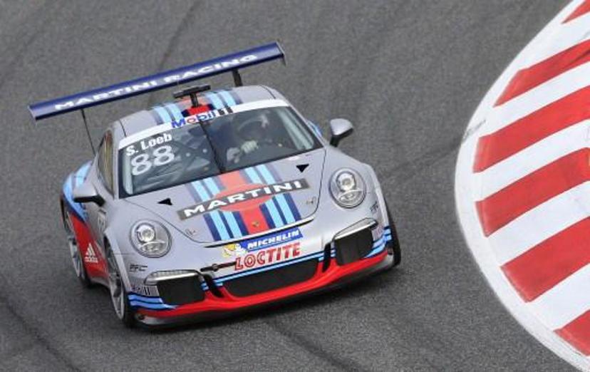 Nine times World Rally Champion, France's Sebastien Loeb drives in the Porsche GT3 Supercup race held in Montmelo near Barcelona on May 10, 2013. AFP PHOTO / ALEXANDER KLEIN