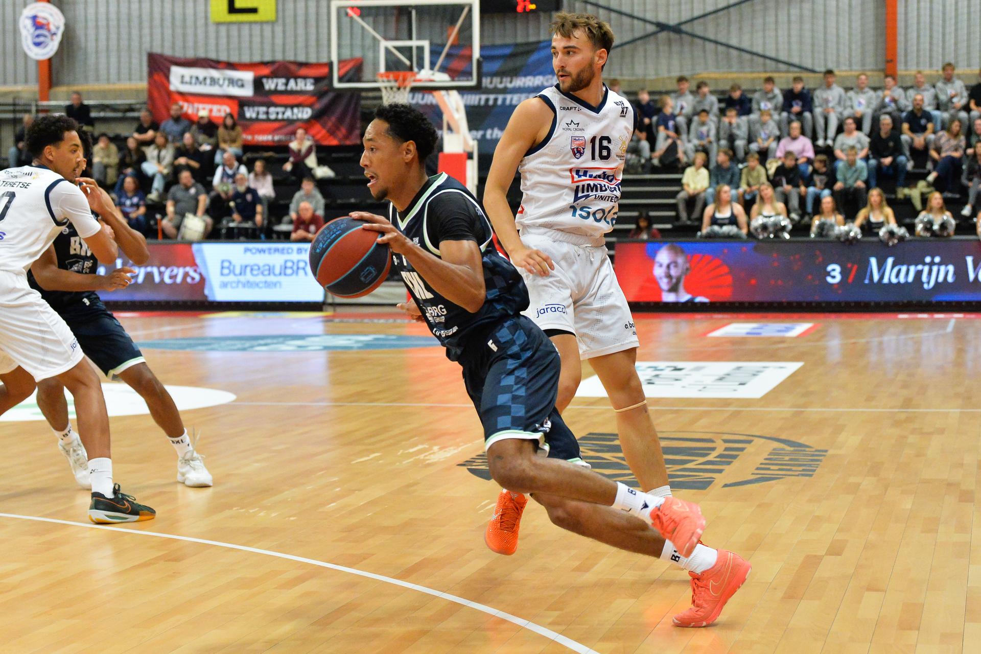 Brussels' Jamison Overton and Limburg's Wout Leemans pictured in action during a basketball match between Limburg United and Brussels, Friday 03 October 2025 in Mechelen, on day 2 of the 'BNXT League' Belgian/ Dutch first division basket championship. BELGA PHOTO JILL DELSAUX