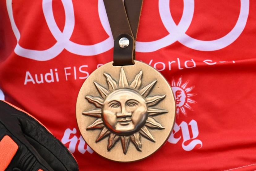 The Sun Valley logo is seen on the medal of first place winner Switzerland's Lara Gut-Behrami on the podium for the women's Super-G event at the Audi FIS Ski World Cup Sun Valley Finals in Sun Valley, Idaho on March 23, 2025.  Patrick T. Fallon / AFP