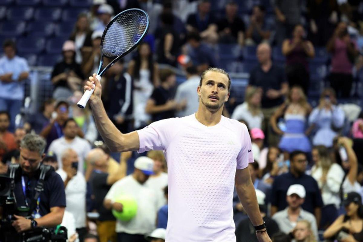Germany's Alexander Zverev waves his racquet to the crowd after defeating Chile's Alejandro Tabilo during their men's singles third-round tennis match on day seven of the US Open tennis tournament at the USTA Billie Jean King National Tennis Center in New York City in the early hours of September 6, 2026.  Leonardo MUNOZ / AFP