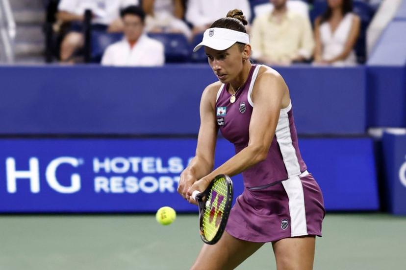 Belgium's Elise Mertens hits a return to Japan's Naomi Osaka in their women's singles third round tennis match on day seven of the US Open tennis tournament at the USTA Billie Jean King National Tennis Center in New York City on September 5, 2026.  kena betancur / AFP