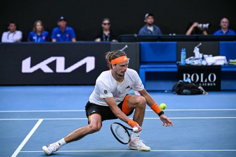 Germany's Alexander Zverev hits a shot against Spain's Carlos Alcaraz during their men's singles semi-final match on day thirteen of the Australian Open tennis tournament in Melbourne on January 30, 2026.  WILLIAM WEST / AFP