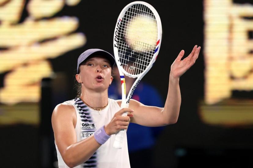 Poland's Iga Swiatek celebrates victory over China's Yuan Yue after their women's singles match on day two of the Australian Open tennis tournament in Melbourne on January 19, 2026.  DAVID GRAY / AFP
