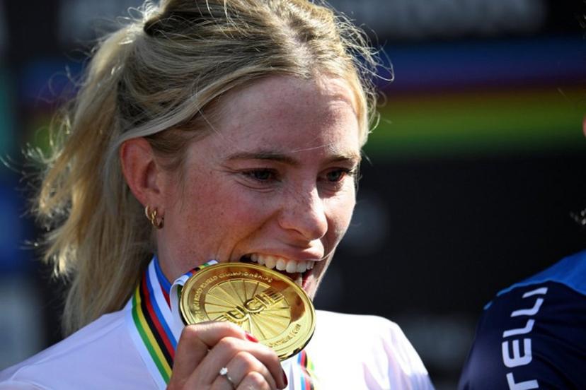 First-placed Demi Vollering of the Netherlands poses on the podium after the Women's Elite Road Race at the 2026 Union Cycliste Internationale (UCI) Road World Championships in Montreal, Quebec, on September 26, 2026.  Andrej Ivanov / AFP
