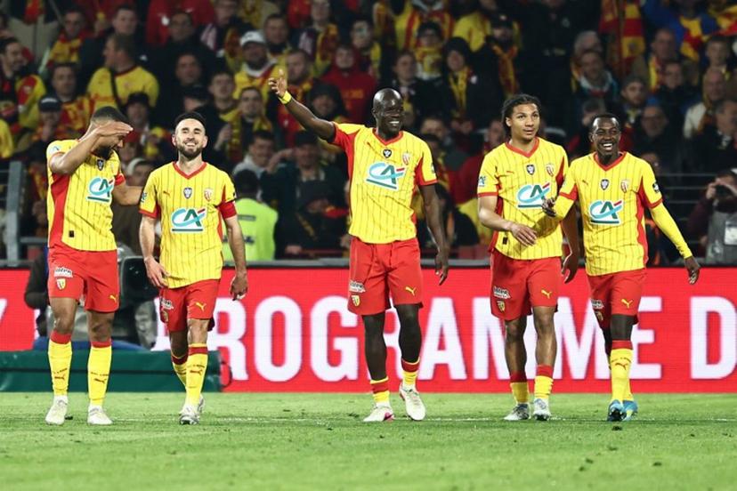 Lens' Saudi Arabian defender #23 Saud Abdulhamid (R) is congratulated after scoring his team's fourth goal during the French Cup semi-final football match between and RC Lens and Toulouse FC at the Stade Bollaert-Delelis in Lens, northern France on April 21, 2026.   Sameer AL-DOUMY / AFP