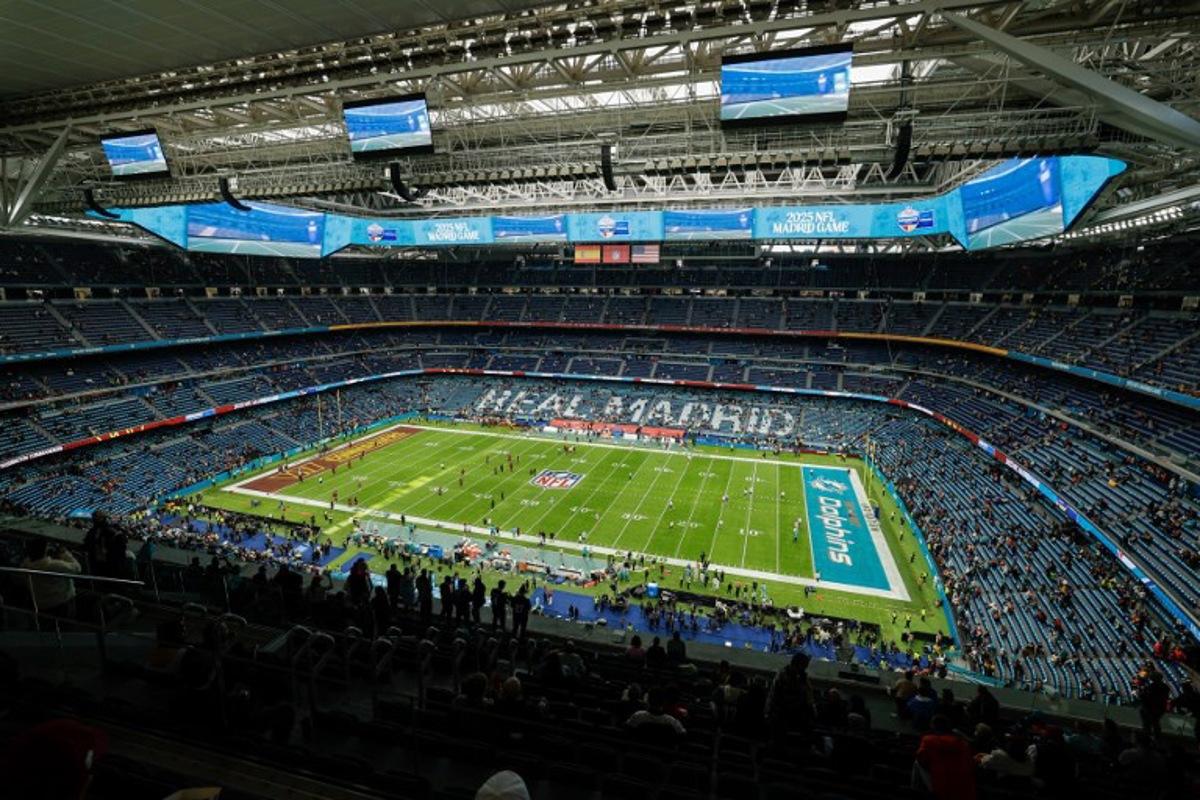 A general view shows the Santiago Bernabeu stadium before the NFL match between Miami Dolphins and Washington Commanders at Santiago Bernabeu Stadium in Madrid on November 16, 2025.  Oscar DEL POZO / AFP