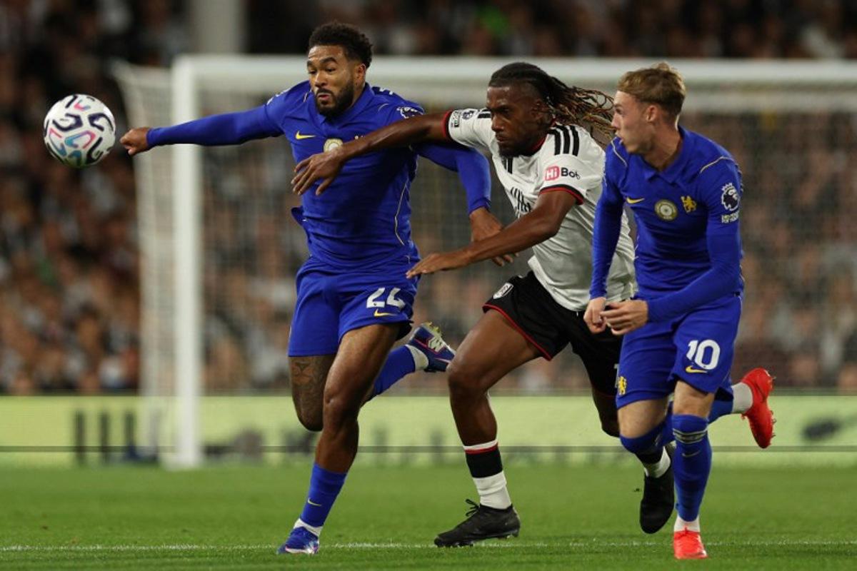 Chelsea's English defender #24 Reece James (L) vies with Fulham's Nigerian midfielder #17 Alex Iwobi (C) during the English Premier League football match between Fulham and Chelsea at Craven Cottage in London on August 24, 2026.  Adrian Dennis / AFP