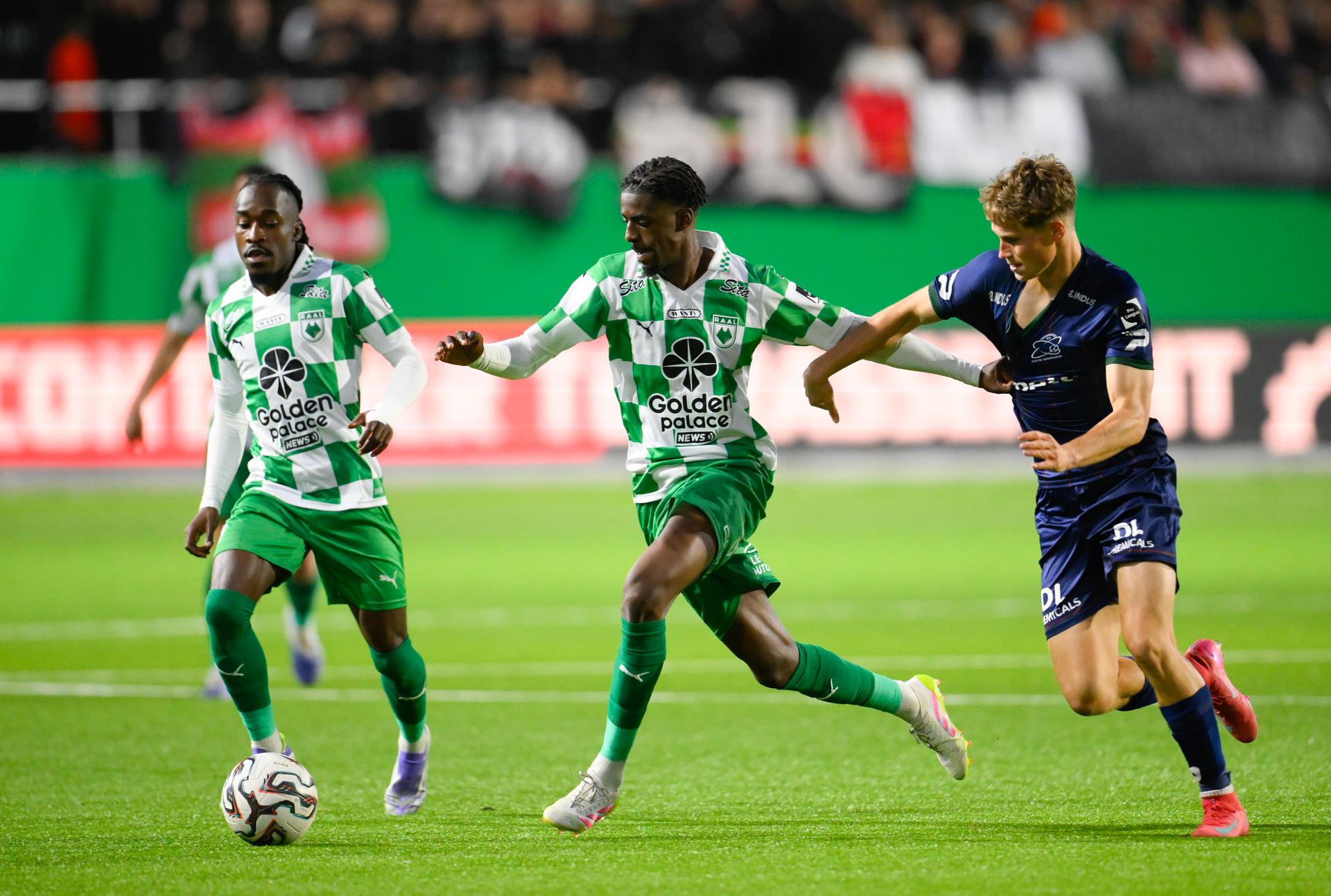 Essevee's Jeppe Erenbjerg and RAAL's Joel Ito fight for the ball during a soccer match between RAAL La Louviere and Zulte Waregem, Saturday 04 October 2025 in La Louviere, on day 10 of the 2025-2026 'Jupiler Pro League' first division of the Belgian championship. BELGA PHOTO JOHN THYS