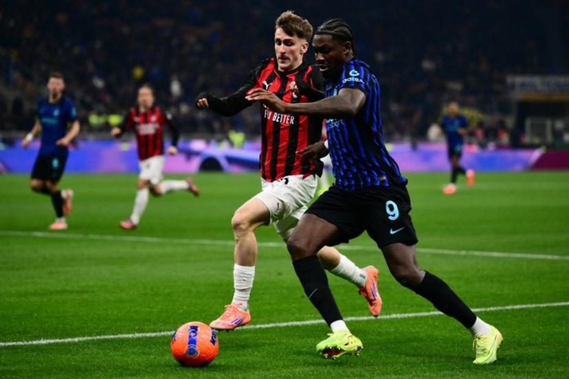AC Milan's Begian midfielder #56 Alexis Saelemaekers and Inter Milan's French forward #09 Marcus Thuram vie for the ball during the Italian Serie A football match between Inter Milan and AC Milan at San Siro stadium in Milan, northern Italy, on November 23, 2025.  Marco BERTORELLO / AFP