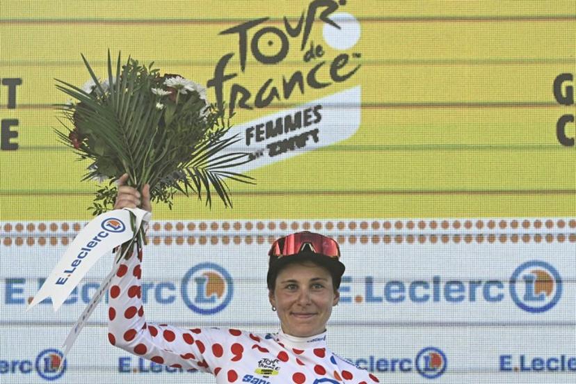 Guest and FDJ-SUEZ team's Swiss rider Elise Chabbey celebrates on the podium with the best climber's polka dot (dotted) jersey after the 5th stage (out of 9) of the fourth edition of the Women's Tour de France cycling race, 165.8 km from Chasseneuil-du-Poitou to Gueret, in Gueret, central France on July 30, 2025.  JULIEN DE ROSA / AFP