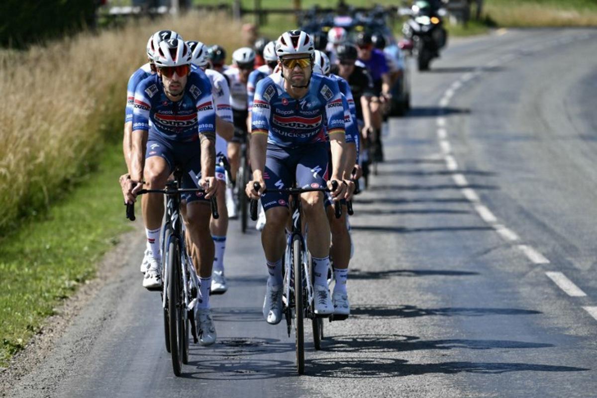 Soudal Quick-Step team's Italian rider Mattia Cattaneo (L) and Soudal Quick-Step team's German rider Maximilian Schachmann cycle in a training session on the eve of the start of the 112th edition of the Tour de France cycling race, near Arras, close to Lille, northern France, on July 4, 2025.  Marco BERTORELLO / AFP