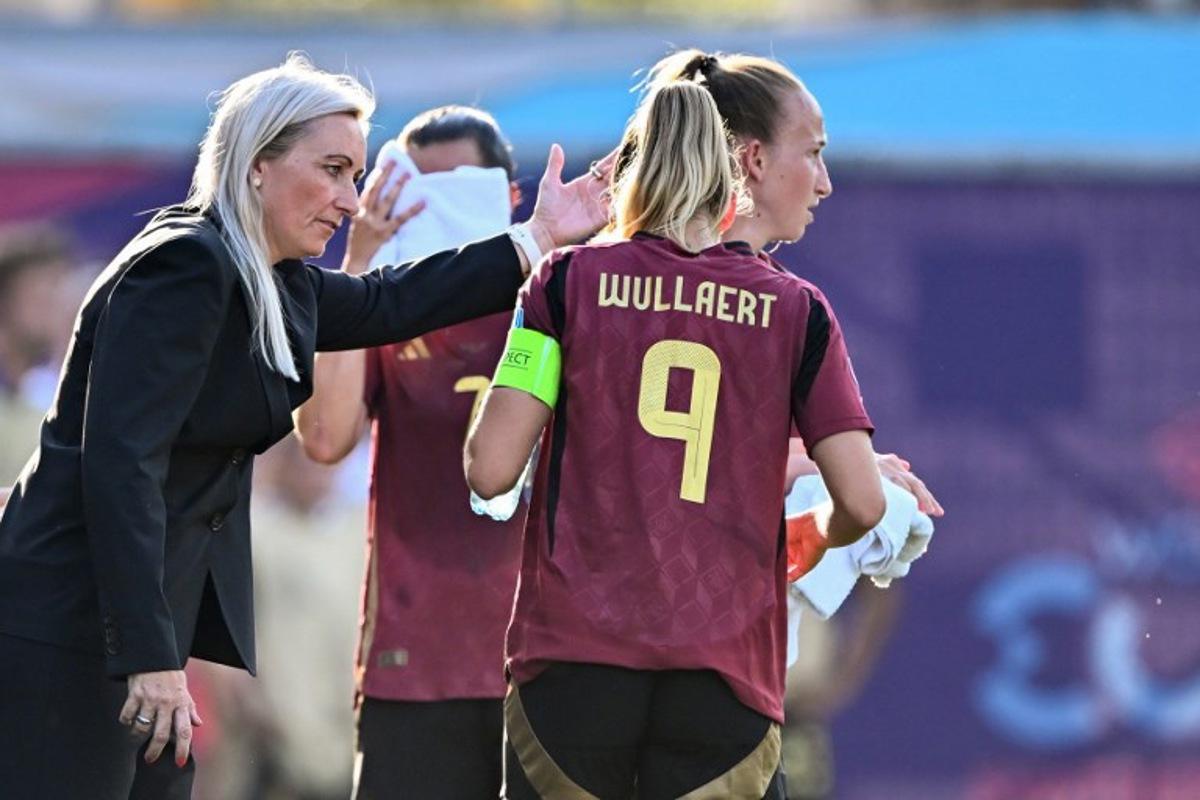 Belgium's Icelandic coach Elisabet Gunnarsdottir gestures as she speaks with Belgium's forward #09 Tessa Wullaert during the UEFA Women's Euro 2025 Group B football match between Belgium and Italy at the Stade de Tourbillon in Sion, on July 3, 2025.  Fabrice COFFRINI / AFP