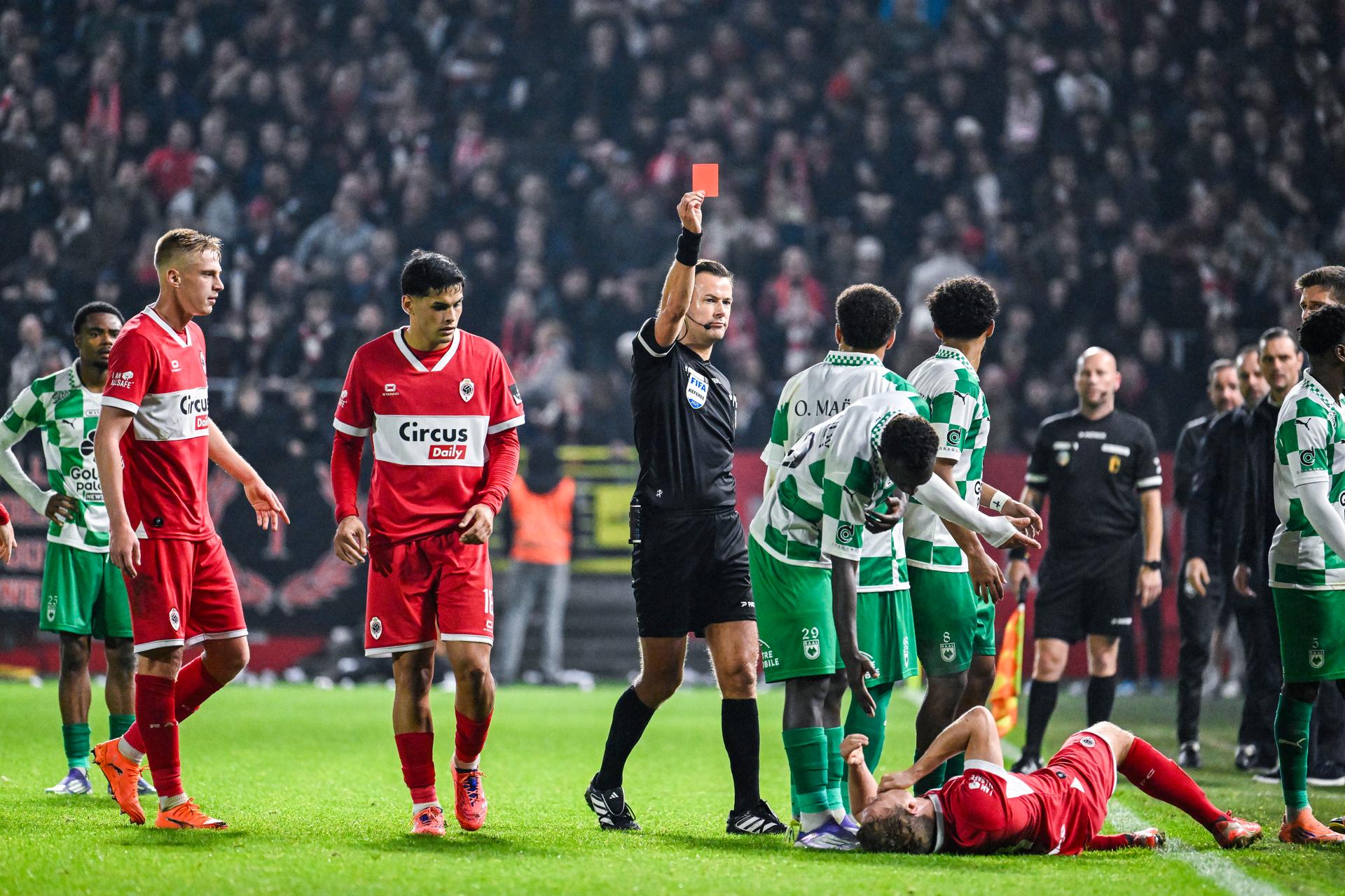 RAAL's Owen Maes receives a red card from referee Bram Van Driessche during a soccer match between Royal Antwerp FC and Raal La Louviere, Saturday 08 November 2025 in Antwerp, on day 14 of the 2025-2026 'Jupiler Pro League' first division of the Belgian championship. BELGA PHOTO TOM GOYVAERTS