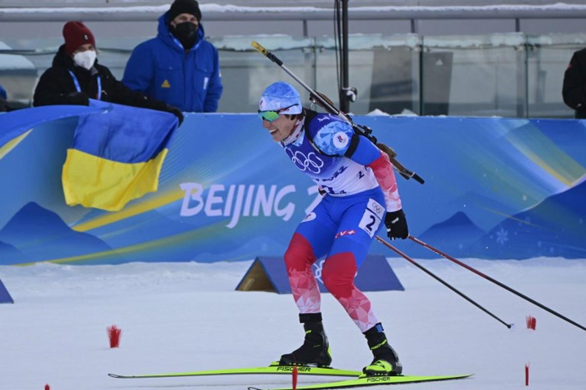 Russia's Eduard Latypov skies to the finish line in the Biathlon Men's 4x7.5km Relay event, on February 15, 2022 at the Zhangjiakou National Biathlon Centre, during the Beijing 2022 Winter Olympic Games.  Tobias SCHWARZ / AFP