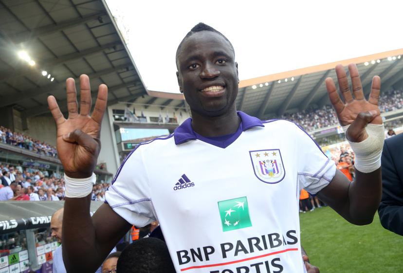 20140518 - BRUSSELS, BELGIUM: Anderlecht's Cheikhou Kouyate pictured during celebrations as RSC Anderlecht wins the Belgian championship Jupiler Pro League for the third consecutive time, after the match of Play-Off 1 between Anderlecht and SV Zulte Waregem, Sunday 18 May 2014 in Brussels, on the tenth and last day of the Play-Off 1 of the Belgian soccer championship. BELGA PHOTO VIRGINIE LEFOUR