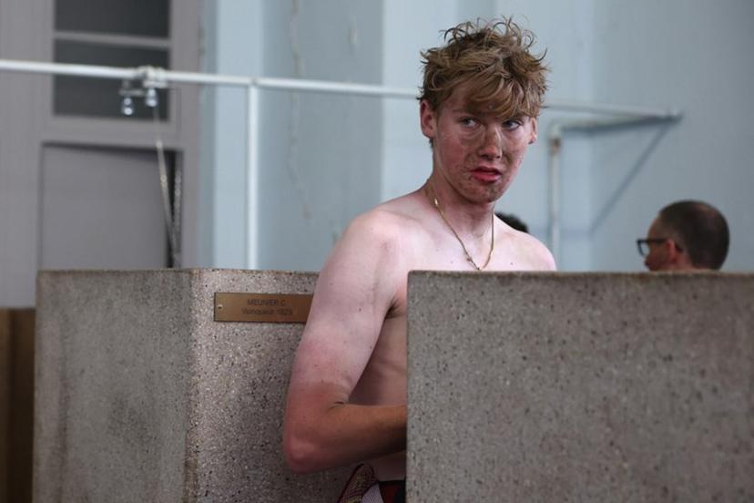 Modern Adventure Pro Cycling's US rider Ezra Caudell takes a shower at the end of the 123rd edition of the Paris-Roubaix one-day classic cycling race, 258.3 km between Compiègne and Roubaix, at the Vélodrome André-Pétrieux in Roubaix, northern France, on April 12, 2026.  Anne-Christine POUJOULAT / AFP