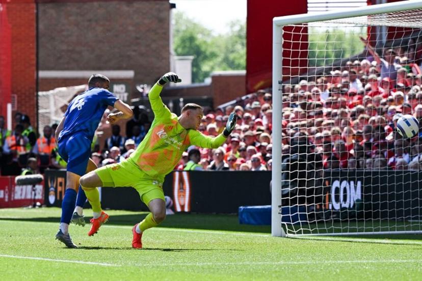 Leicester City's English defender #04 Conor Coady heads the ball and scores his team first goal past Nottingham Forest's Belgian goalkeeper #26 Matz Sels during the English Premier League football match between Nottingham Forest and Leicester City at The City Ground in Nottingham, central England, on May 11, 2025.  JUSTIN TALLIS / AFP