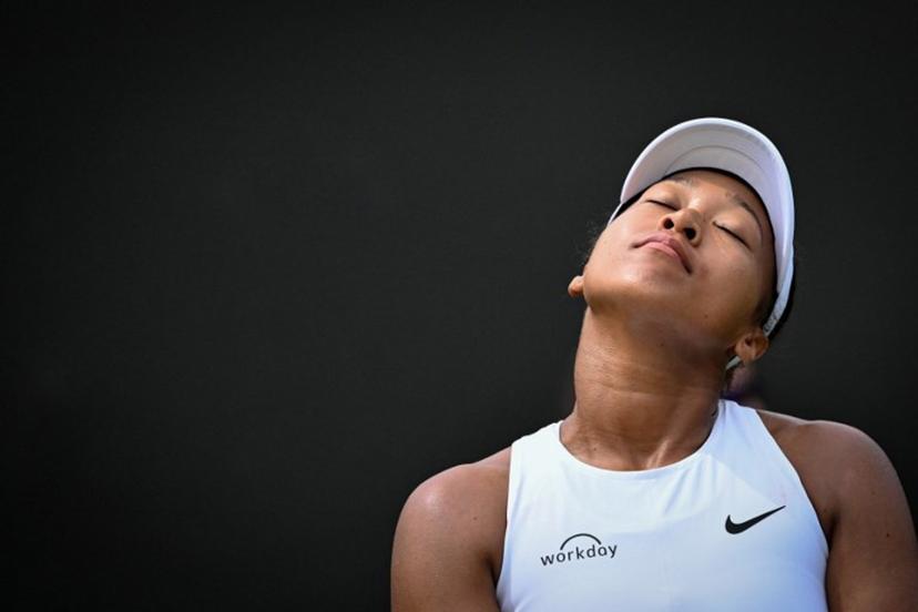 Japan's Naomi Osaka reacts as she plays against Russia's Anastasia Pavlyuchenkova during their women's singles third round tennis match on the fifth day of the 2025 Wimbledon Championships at The All England Lawn Tennis and Croquet Club in Wimbledon, southwest London, on July 4, 2025.  Kirill KUDRYAVTSEV / AFP