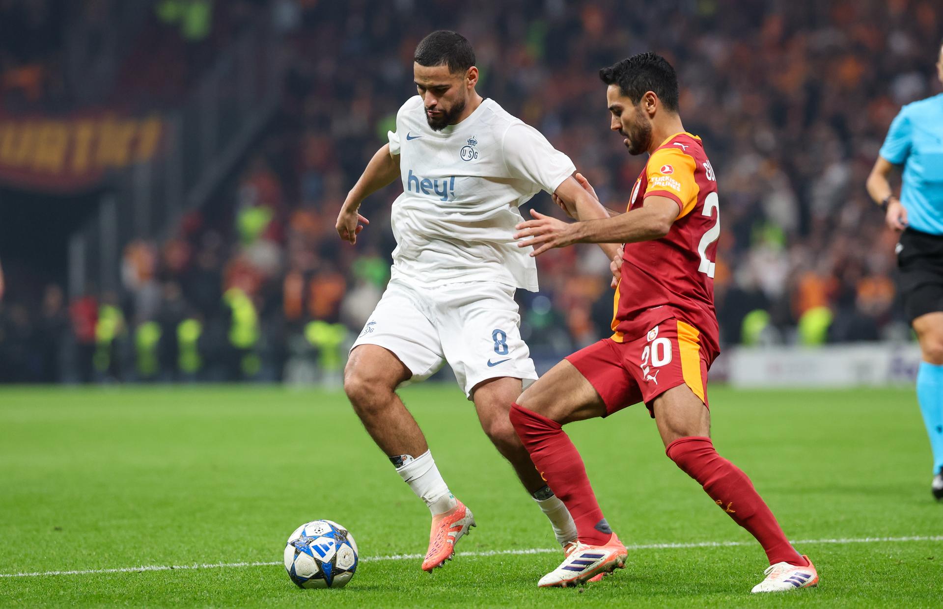 Union's Adem Zorgane and Galatasaray's Ilkay Gundogan fight for the ball during a soccer game between Turkish Galatasaray SK and Belgian Royale Union Saint-Gilloise on Tuesday 25 November 2025 in Istanbul, Turkey, on day 5 of the League phase of the UEFA Champions League tournament. BELGA PHOTO VIRGINIE LEFOUR