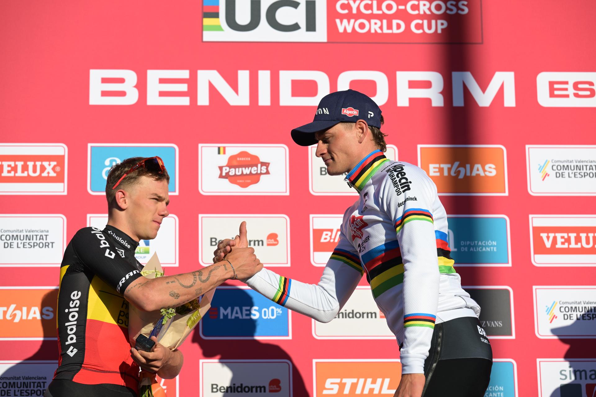 Belgian Thibau Nys and Dutch Mathieu Van Der Poel pictured on the podium after the Men's Elite race at the cyclocross cycling event in Benidorm, Spain, Sunday 18 January 2026, stage 10/12 in the UCI World Cup competition. BELGA PHOTO DAVID PINTENS