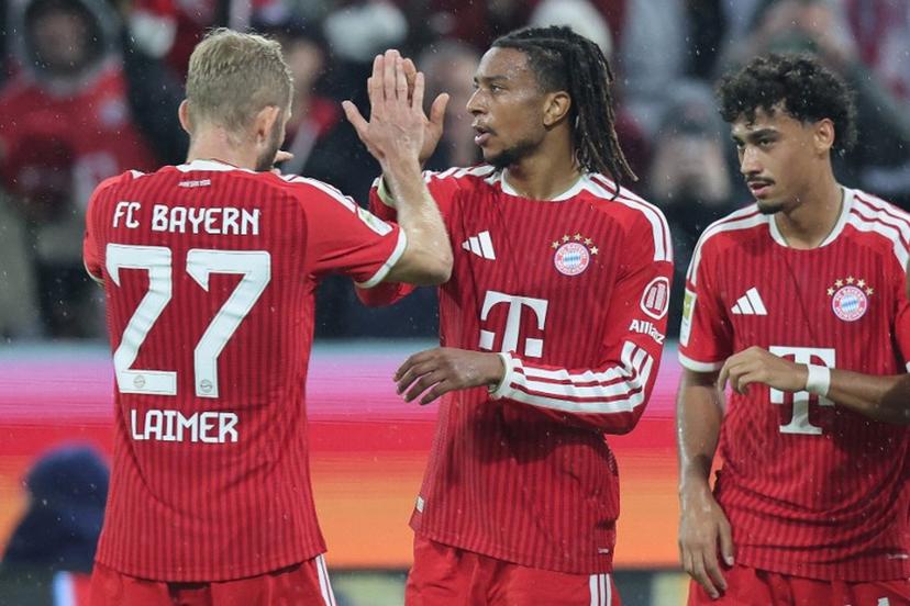 Bayern Munich's French midfielder #17 Michael Olise (C) celebrates scoring the 3-0 goal with his teammates including Bayern Munich's Austrian midfielder #27 Konrad Laimer (L) during the German first division Bundesliga football match between FC Bayern Munich and RB Leipzig in Munich, southern Germany, on October 17, 2026.  Alexandra BEIER / AFP