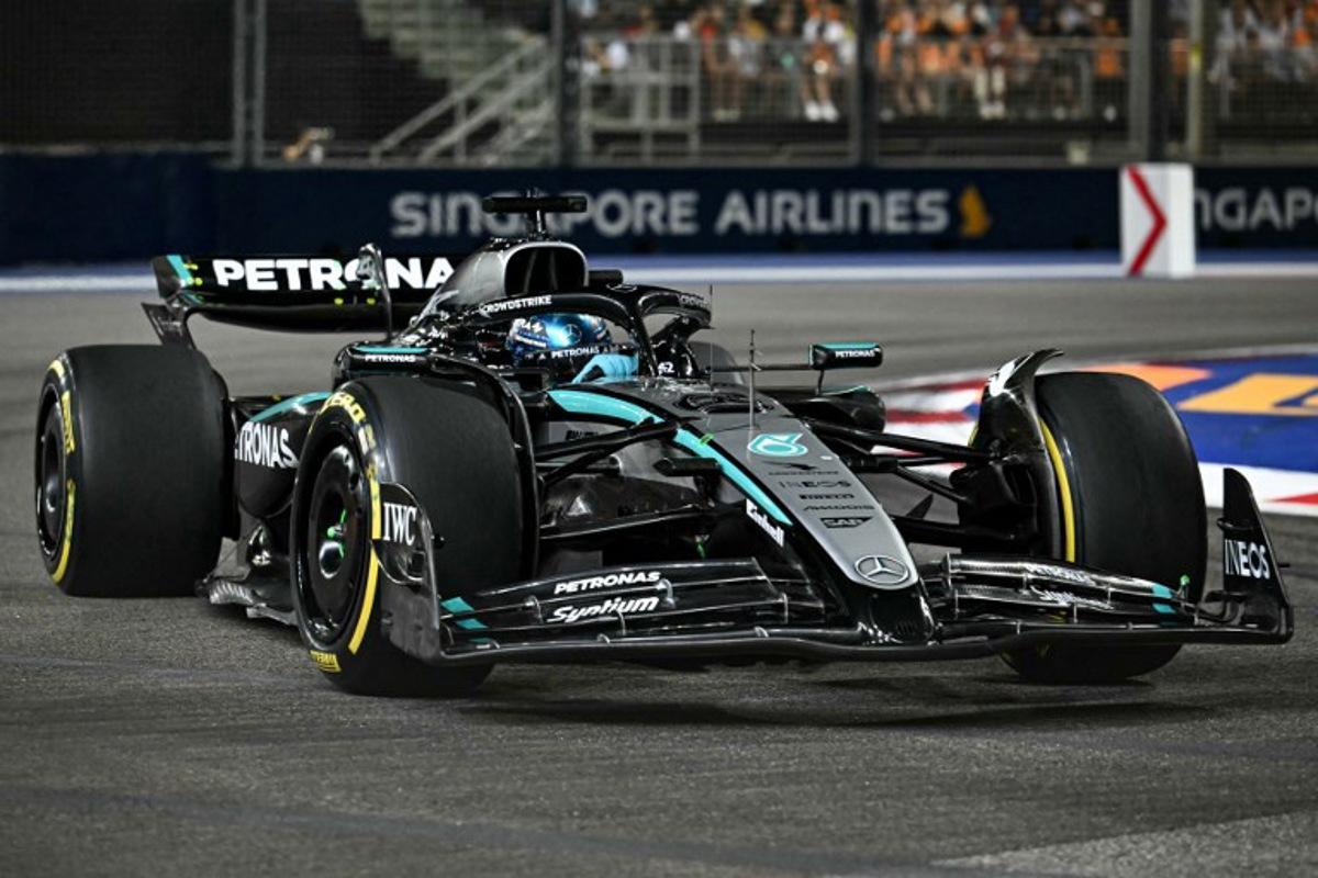 Mercedes' British driver George Russell drives during the Formula One Singapore Grand Prix night race at the Marina Bay Street Circuit in Singapore on October 5, 2025.  MOHD RASFAN / AFP