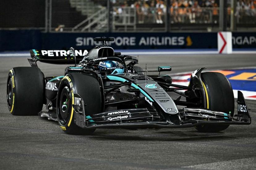 Mercedes' British driver George Russell drives during the Formula One Singapore Grand Prix night race at the Marina Bay Street Circuit in Singapore on October 5, 2025.  MOHD RASFAN / AFP