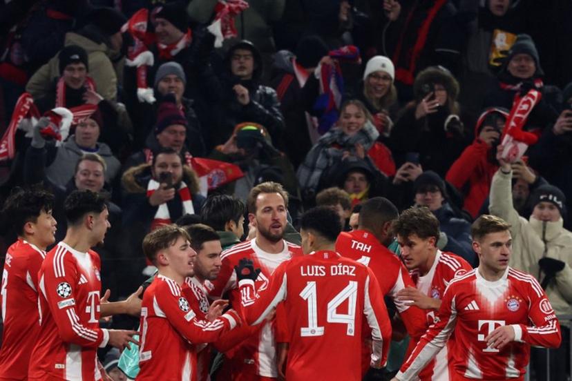 Bayern Munich's English forward #09 Harry Kane (C) is celebrated by team mates after scoring the opening goal 1-0 during the UEFA Champions League football match between FC Bayern Munich (GER) and Royale Union St-Gilloise (BEL) in Munich, southern Germany, on January 21, 2026.  Karl-Josef HILDENBRAND / AFP