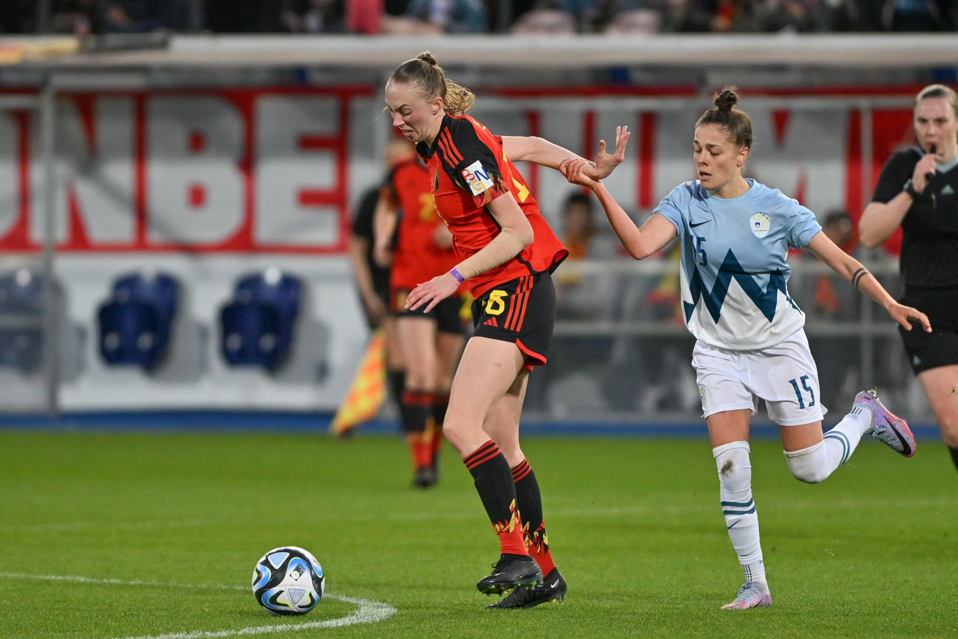 Belgium's Lisa Petry and Slovenian Sara Makovec fight for the ball during a friendly soccer match between Belgium's national women's team the Red Flames and Slovenia on Tuesday 11 April 2023 in Leuven. BELGA PHOTO DAVID CATRY