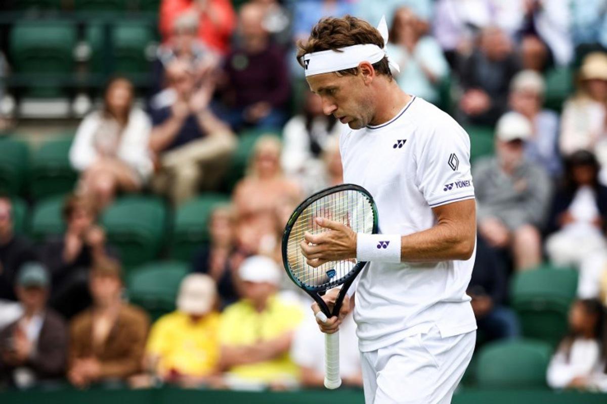 Norway's Casper Ruud reacts as he plays against Australia's Alex Bolt during their men's singles tennis match on the first day of the 2024 Wimbledon Championships at The All England Lawn Tennis and Croquet Club in Wimbledon, southwest London, on July 1, 2024.  HENRY NICHOLLS / AFP