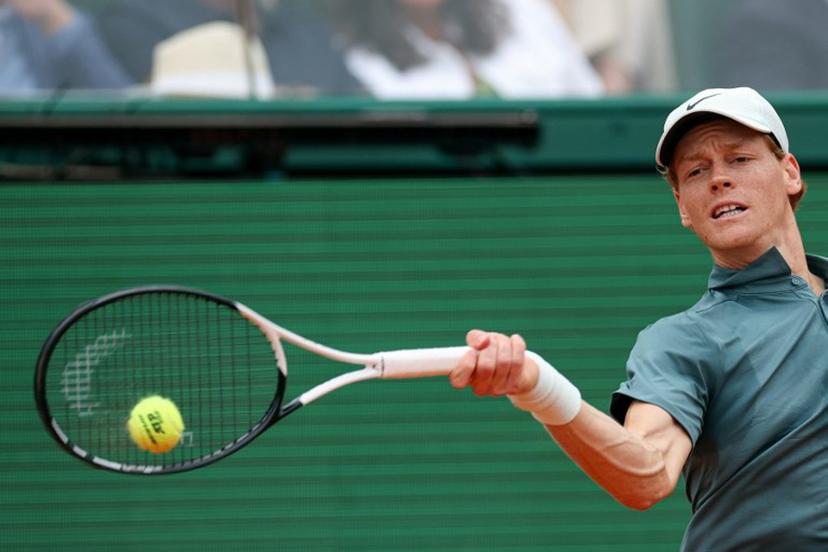 Italy's Jannik Sinner plays a forehand return to Spain's Carlos Alcaraz during the Monte Carlo ATP Masters Series Tournament final tennis match on Court Rainier III at the Monte-Carlo Country Club in Roquebrune-Cap-Martin, south-eastern France on April 12, 2026.  Valery HACHE / AFP