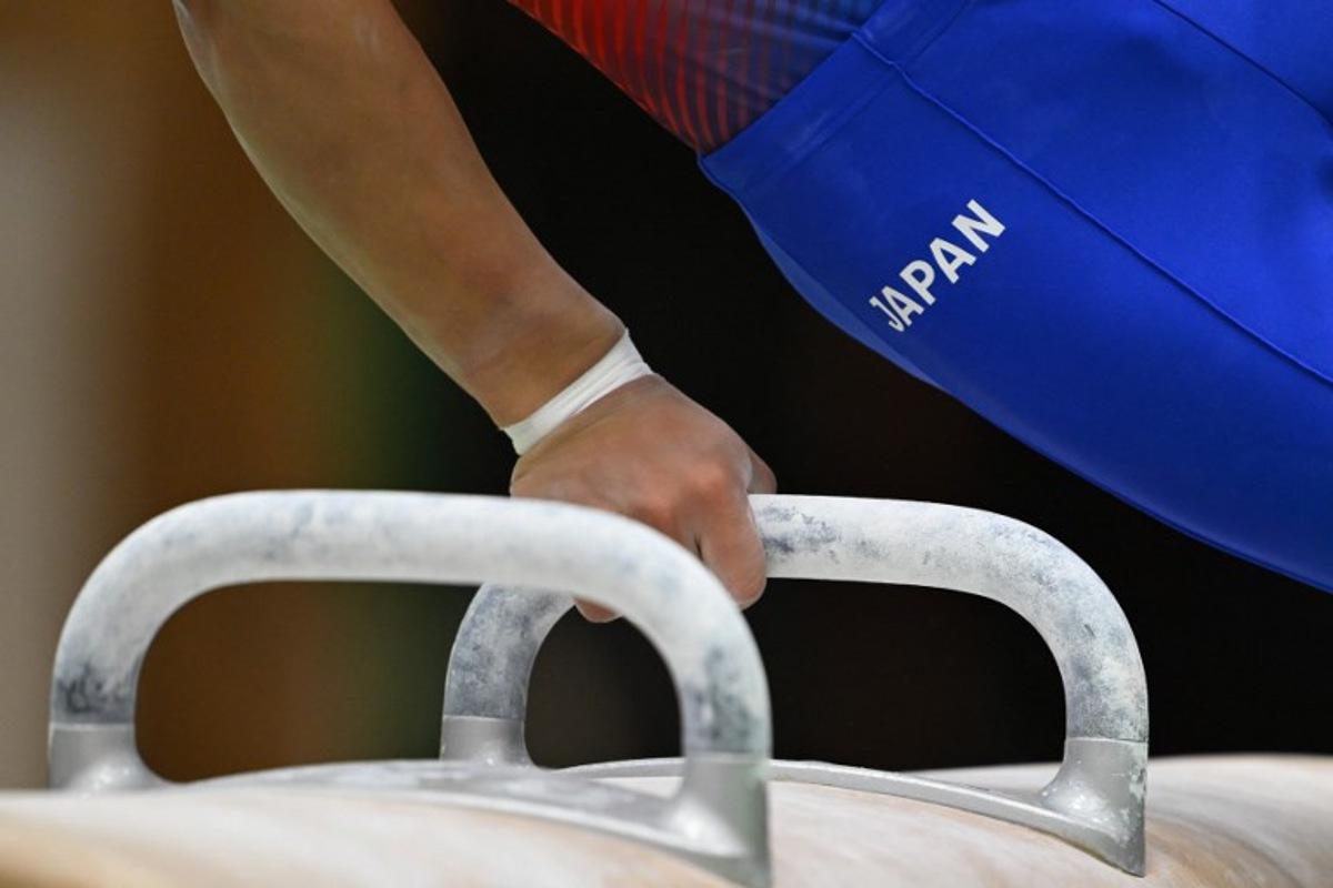 A gymnast practices the pommel horse during a Japan team training exhibition for the media ahead of the Aichi-Nagoya Asian Games in Tokyo on September 9, 2026.  ANDREW CABALLERO-REYNOLDS / AFP