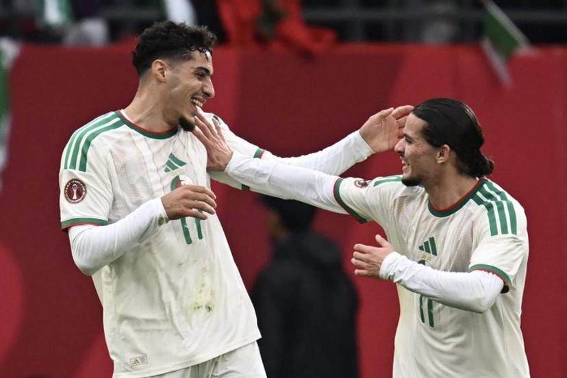 Algeria's midfielder #17 Fares Chaibi (L) celebrates scoring his team's second goal with Algeria's forward #11 Anis Hadj Moussa (R) during the Africa Cup of Nations (CAN) Group E football match between Equatorial Guinea and Algeria at Moulay Hassan Stadium in Rabat on December 31, 2025.   Paul ELLIS / AFP