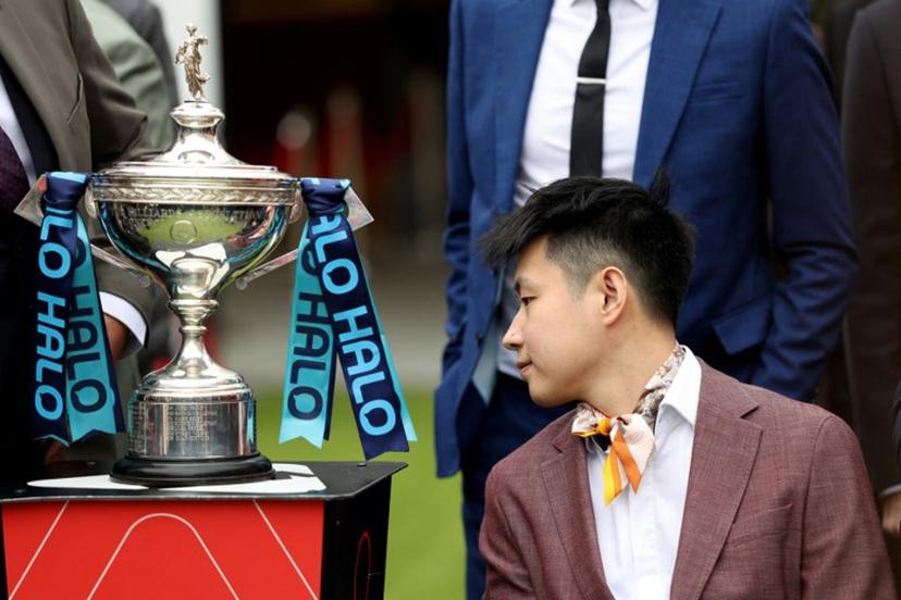 Chinese snooker player Zhao Xintong looks at the trophy during a media day launching the start of the World Snooker Championship 2026 at Crucible Theatre in Sheffield, northern England, on April 17, 2026.  Darren Staples / AFP
