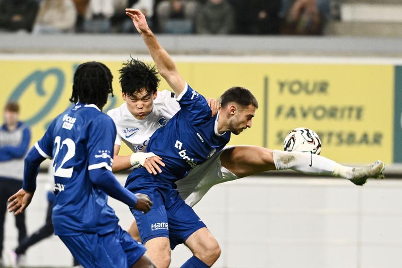 Genk's Hyeon-Gyu Oh and Gent's Matties Volckaert fight for the ball during a soccer match between KAA Gent and KRC Genk, Sunday 09 November 2025 in Gent, on day 14 of the 2025-2026 'Jupiler Pro League' first division of the Belgian championship. BELGA PHOTO MAARTEN STRAETEMANS