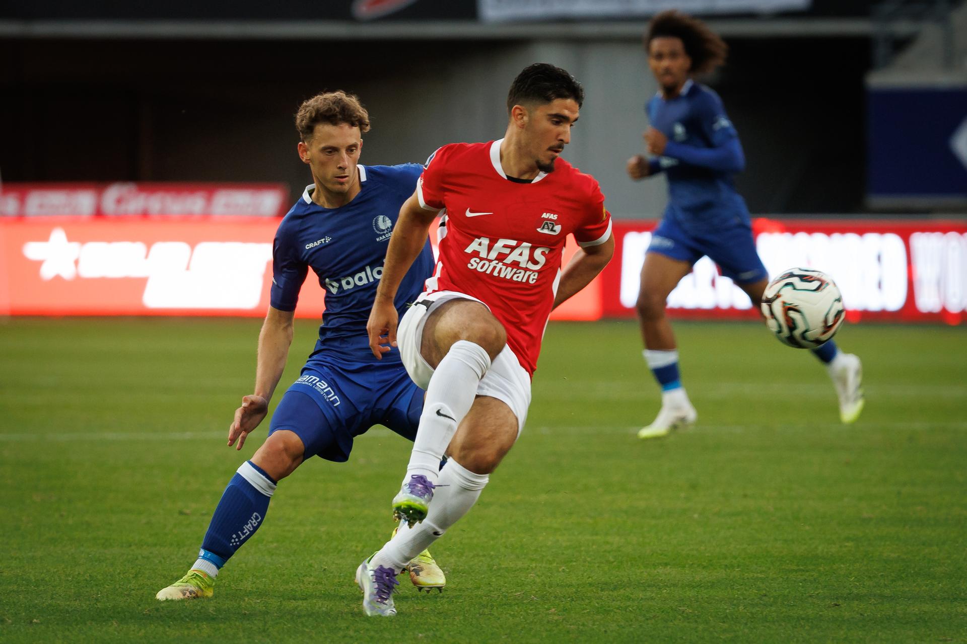 Gent's Gilles De Meyer and AZ's Mayckel Lahdo fight for the ball during a friendly soccer game between Belgian KAA Gent and Dutch AZ Alkmaar, on Wednesday 16 July 2025 in Gent. The teams are preparing for the upcoming 2025-2026 season. BELGA PHOTO KURT DESPLENTER