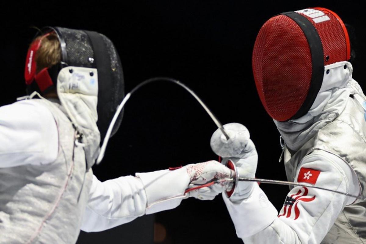 Individual Neutral Athlete Kirill Borodachev and Hong Kong's Choi Chun Yin Ryan compete in the men's foil individual gold medal bout during the FIE Fencing World Championships in Tbilisi on July 23, 2025.  Giorgi ARJEVANIDZE / AFP