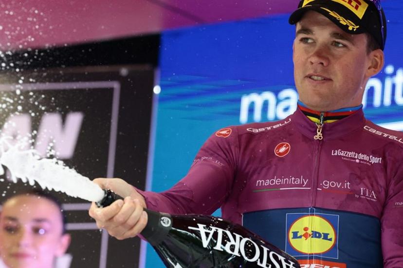 Lidl-Trek's Danish rider Mads Pedersen celebrates the Cyclamen Jersey on the podium of the 12th stage of the 108th Giro d'Italia cycling race of 172kms from Modena to Viadana on May 22, 2025.  Luca Bettini / AFP