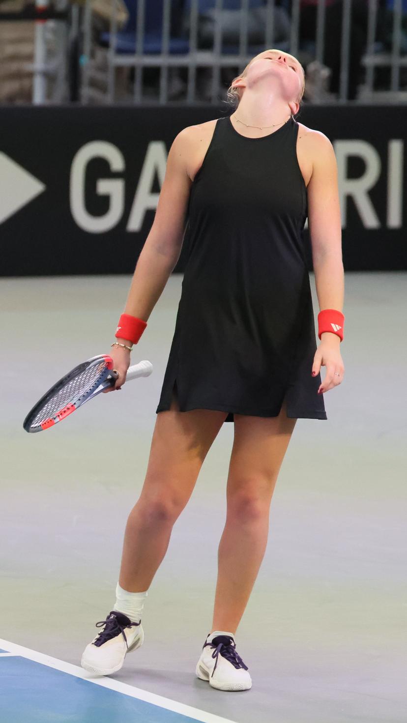Belgian Jeline Vandromme reacts during a tennis match against German Friedsam, during the meeting between Belgium and Germany in the Billie Jean King Cup Play-offs, on Sunday 16 November 2025 in Ismaning, Germany. PHOTO BENOIT DOPPAGNE