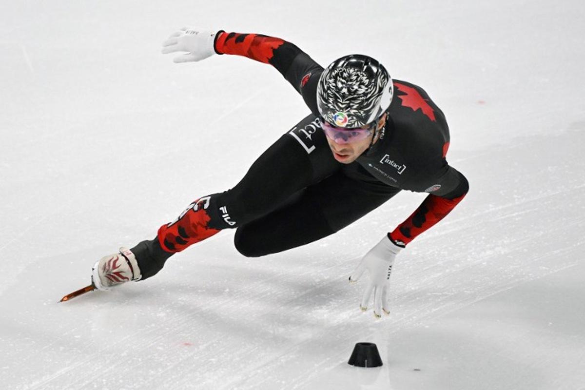 Canada's William Dandjinou competes in the men's 5000m relay final event during the ISU Short Track Championships in Beijing on March 16, 2025.  Jade GAO / AFP