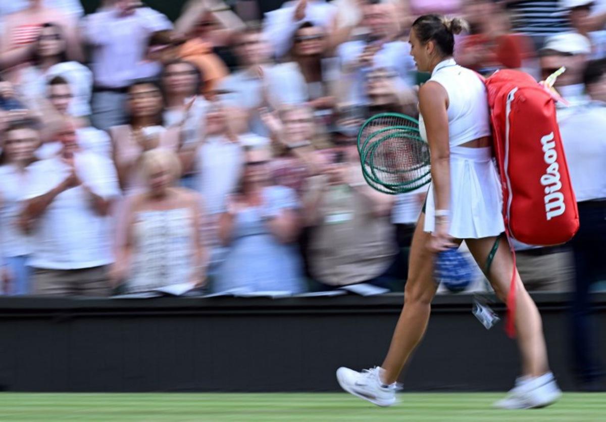Belarus's Aryna Sabalenka leaves the court after being defeated by Japan's Naomi Osaka during their women's singles round of 16 tennis match on the seventh day of the 2026 Wimbledon Championships at The All England Lawn Tennis and Croquet Club in Wimbledon, southwest London, on July 5, 2026.  Kirill KUDRYAVTSEV / AFP