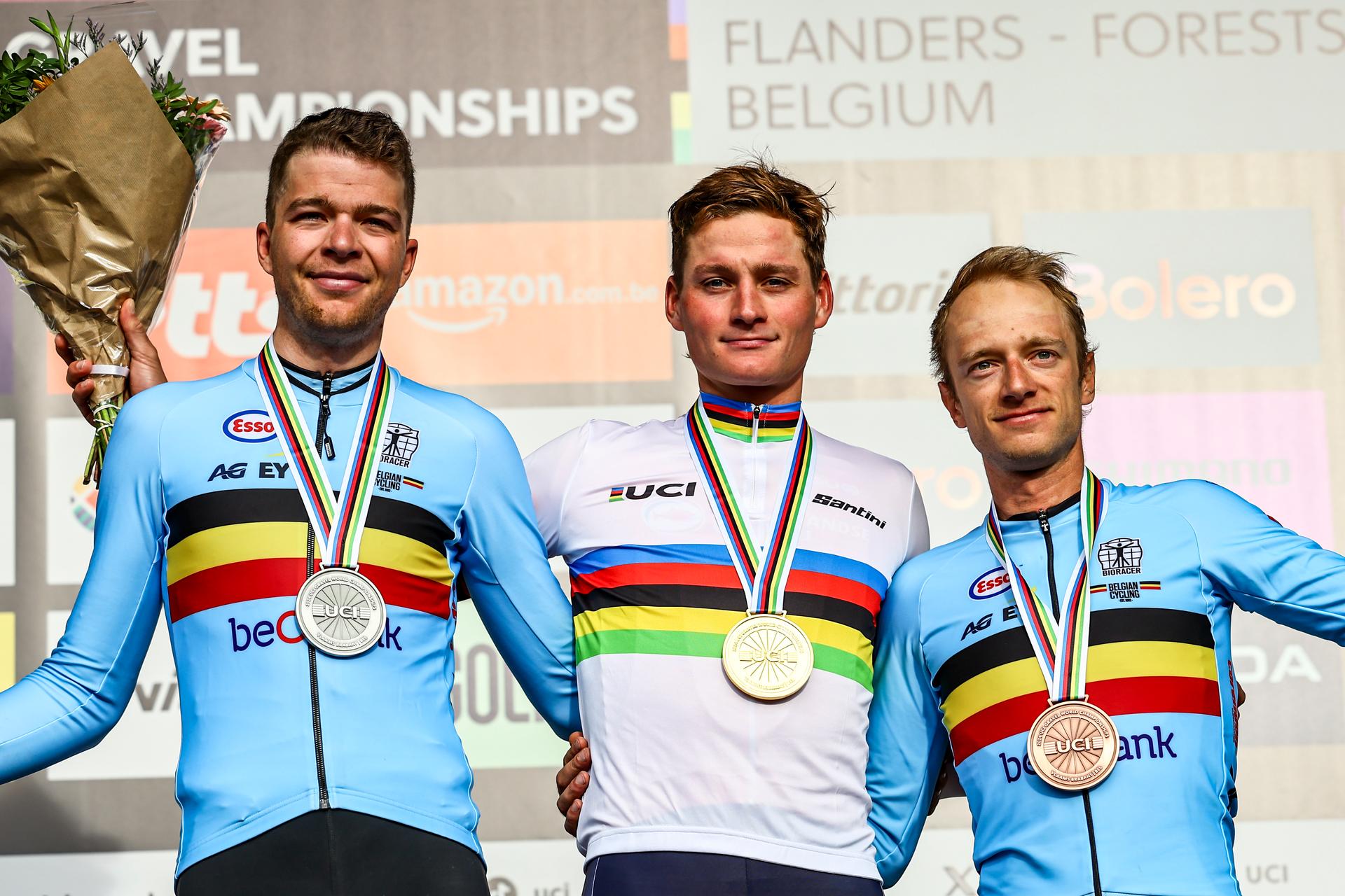 Belgian Florian Vermeersch, Dutch Mathieu Van Der Poel and Belgian Quinten Hermans celebrates on the podium after the men elite race at the UCI World Gravel Championships, Sunday 06 October 2024, in Leuven. BELGA PHOTO DAVID PINTENS