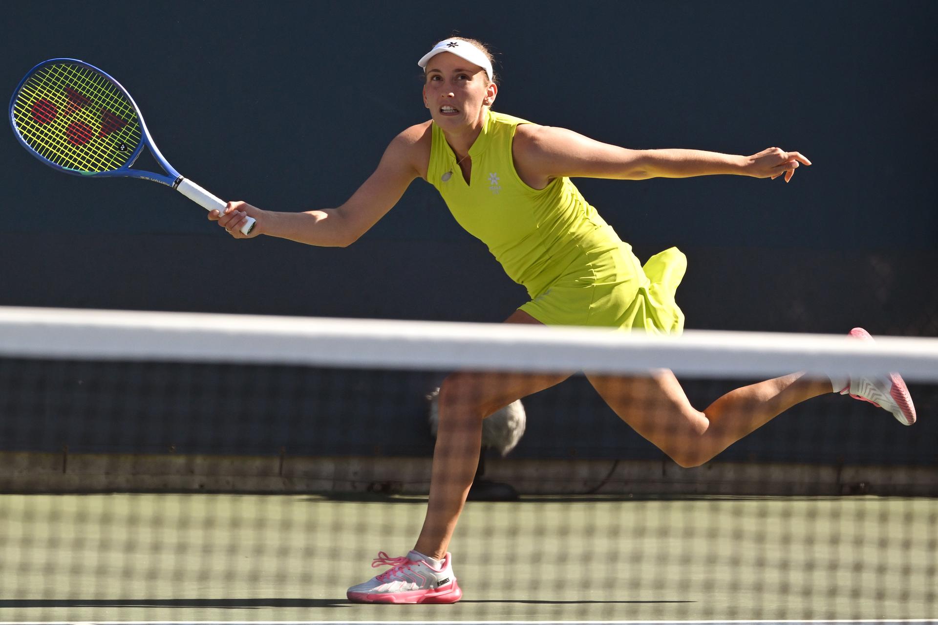 Belgian Elise Mertens (yellow) pictured during a tennis match with Kudermetova against US pair Brantmeier-Hamilton, in the second round of the women's doubles of the 2025 US Open Grand Slam tennis tournament in New York City, USA, Saturday 30 August 2025. BELGA PHOTO TONY BEHAR