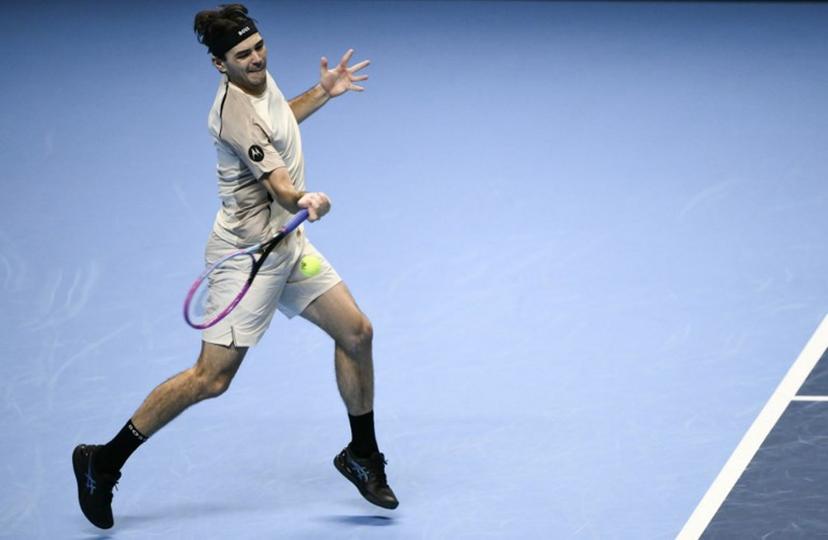 USA's Taylor Fritz hits a return against Italy's Lorenzo Musetti during the ATP Finals tennis tournament in Turin on November 10, 2025. bac Marco BERTORELLO / AFP