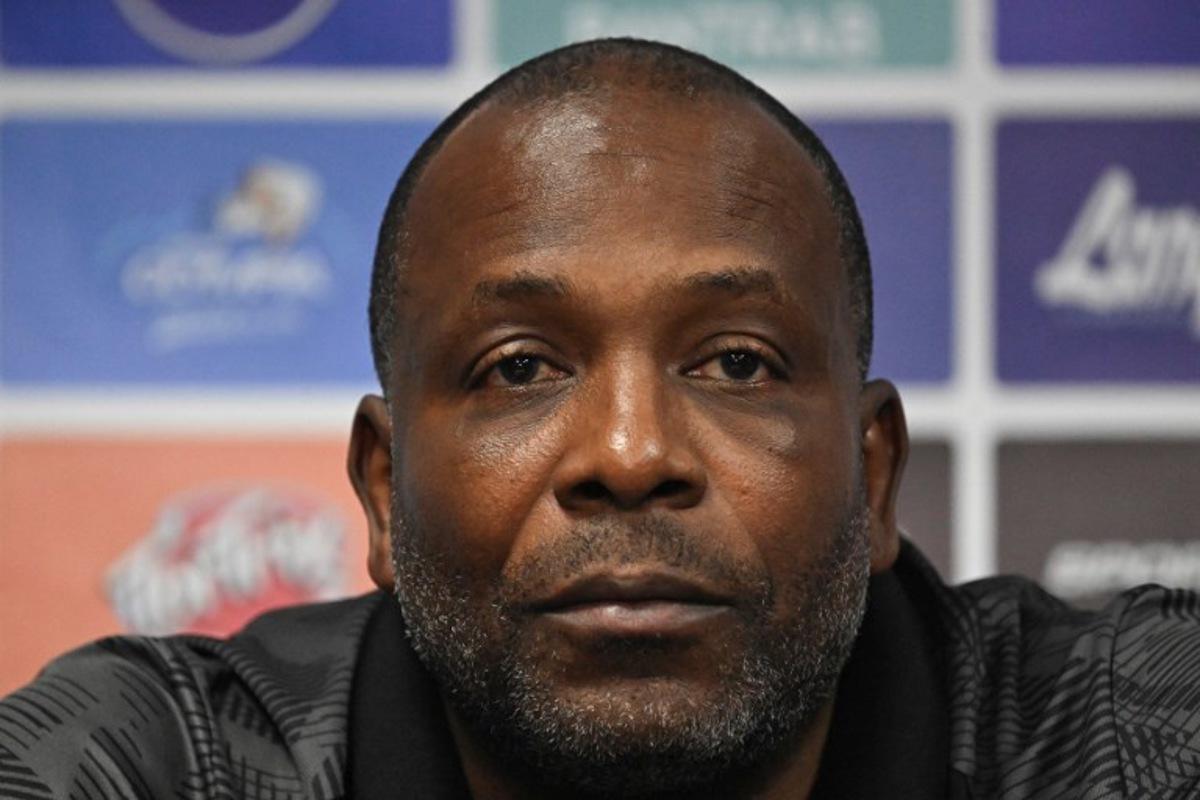 Suriname's head coach Stanley Menzo speaks during a press conference at Manuel Felipe Carrera stadium in Guatemala City on November 17, 2025, ahead of the FIFA World Cup 2026 qualifier football match against Guatemala.  JOHAN ORDONEZ / AFP