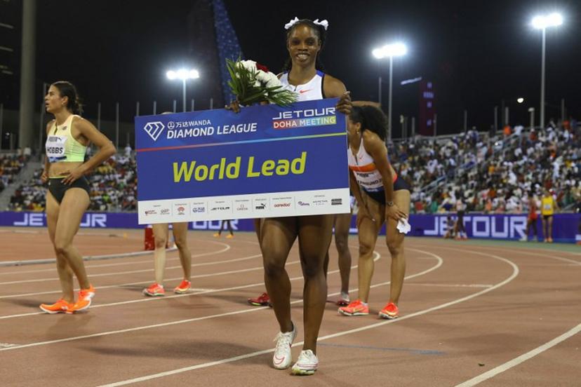 Jamaica's Tia Clayton celebrates after winning the women's 100m final during the IAAF Diamond League competition at the Suheim Bin Hamad Stadium in Doha on May 16, 2025.  Karim JAAFAR / AFP