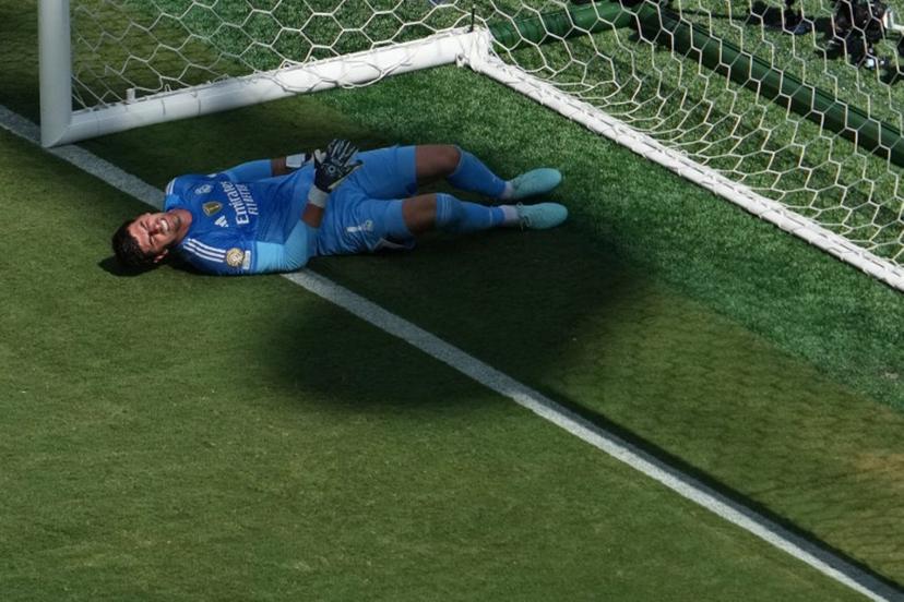 Real Madrid's Belgian goalkeeper #01 Thibaut Courtois reacts in pain during the FIFA Club World Cup 2025 semifinal football match between France's Paris Saint-Germain and Spain's Real Madrid at MetLife stadium in East Rutherford, New Jersey on July 9, 2025.  TIMOTHY A. CLARY / AFP