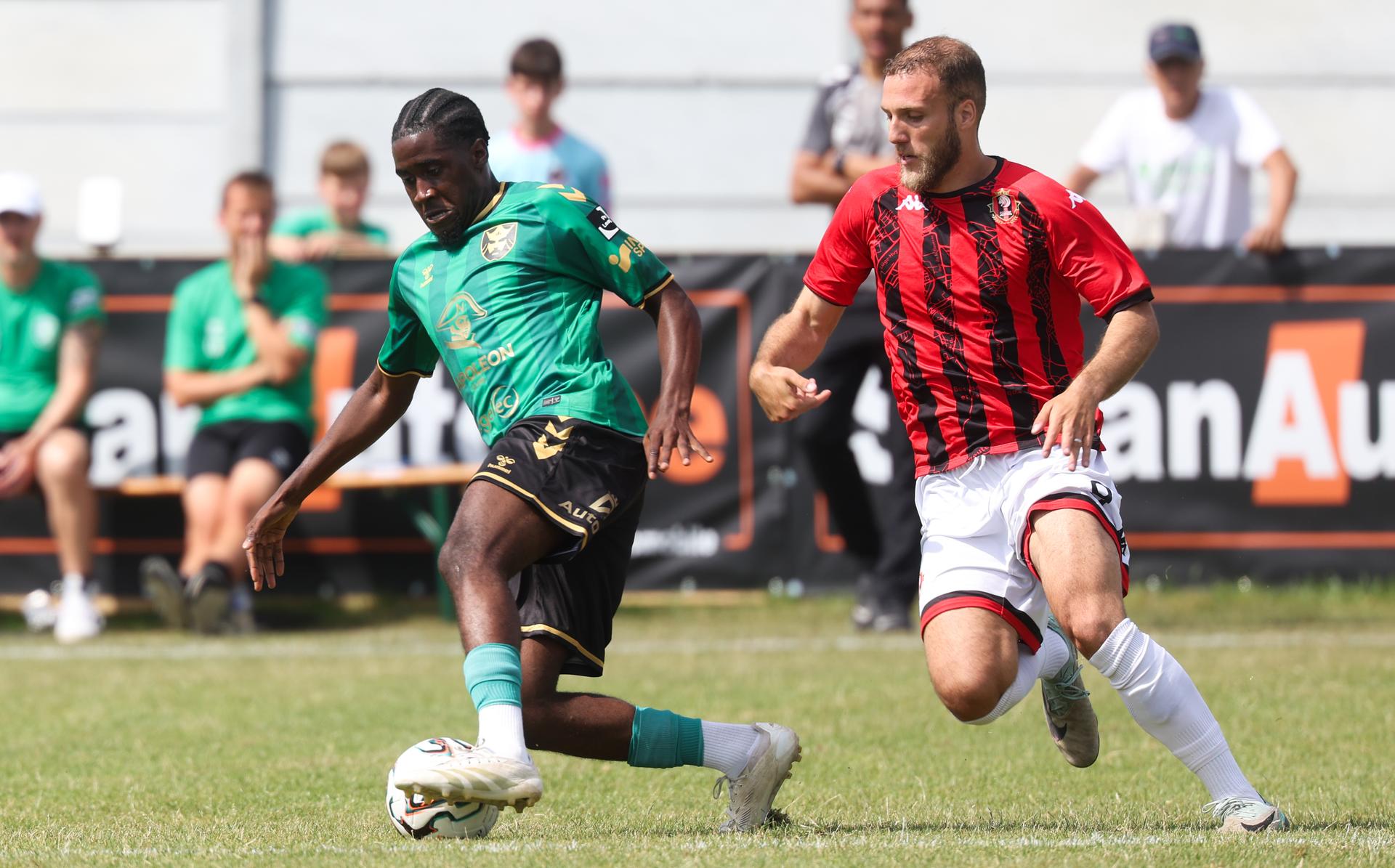 Francs Borains' Lukas Mondele and Seraing's Din Sula fight for the ball during a friendly soccer game between Royal Francs Borains and RFC Seraing, Friday 04 July 2025 in Jemappes, in preparation of the upcoming 2025-2026 season. BELGA PHOTO VIRGINIE LEFOUR